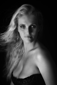 Renate with a single strip light on a black background.